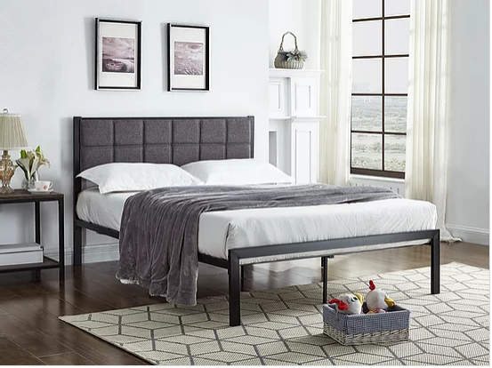 Black Metal Bed With A Padded Grey Fabric Headboard